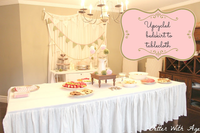 A ruffled tablecloth on a long table.