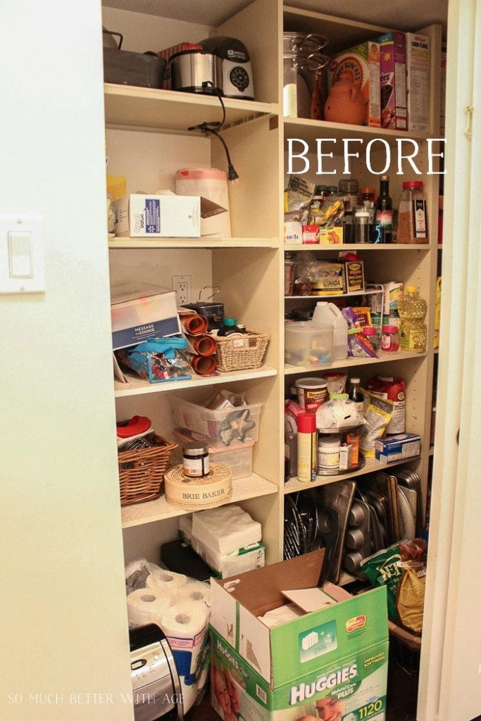 A pantry with multiple shelves cluttered with food items.