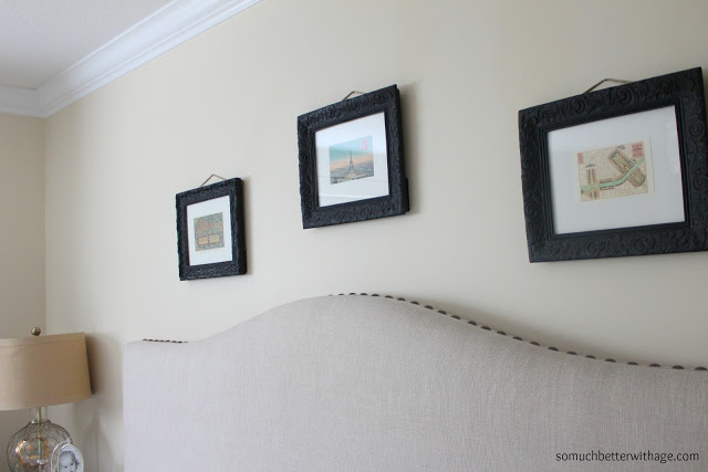 Three matte free framed pictures in the bedroom.