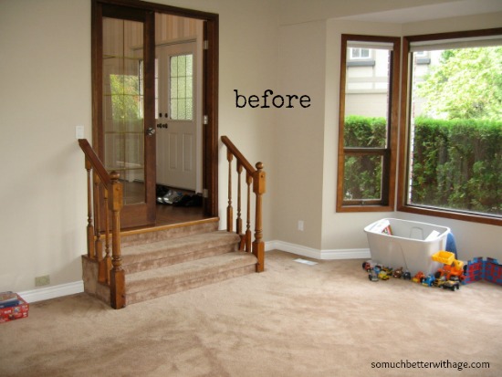 Small set of stairs and a brown rug.
