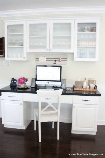 Afterwards a white kitchen desk with cabinets.