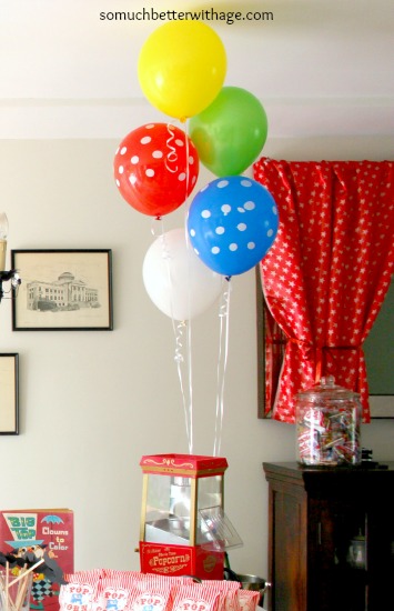 Balloons attached to the mini popcorn machine.