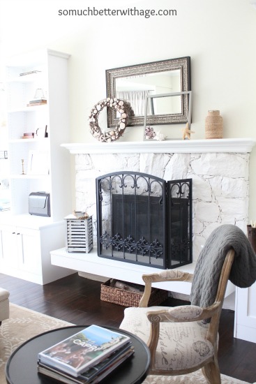 Easy Summer Mantel Update / living room with chair and blanket on chair - So Much Better With Age