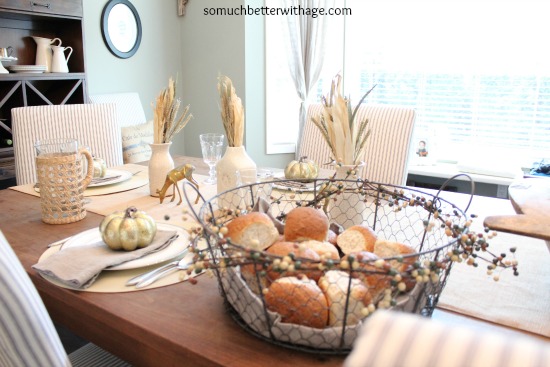 Wire basket filled with bread on the table.