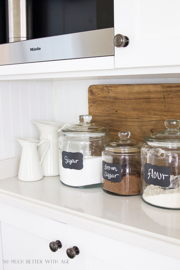 Food Ingredients In Glass Jars On A Kitchen Counter Top. Stock