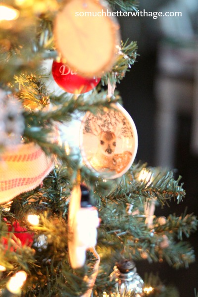 Up close picture of a deer ornament on the tree.