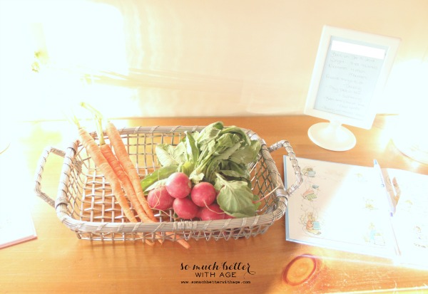 Veggie centrepiece of radishes, carrots and lettuce leaves.