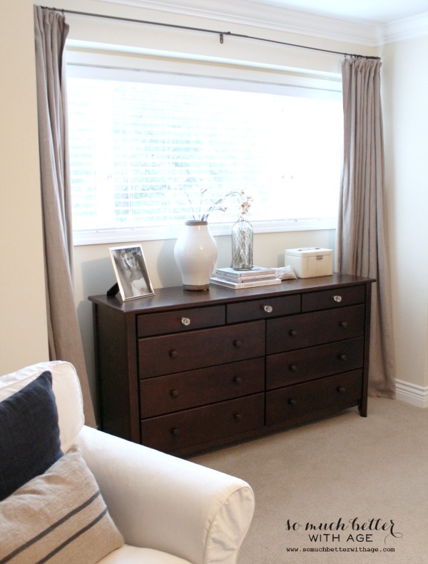 A soft dusty pink curtains in the room.