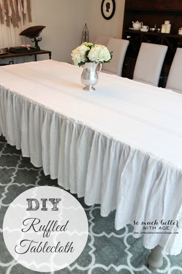 Ruffled white tablecloth on long table.