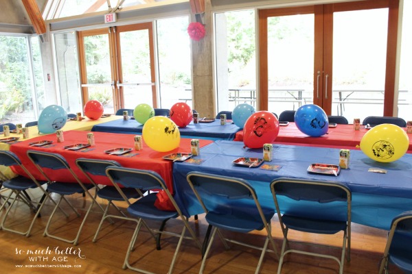 Red and blue table covers in party room.