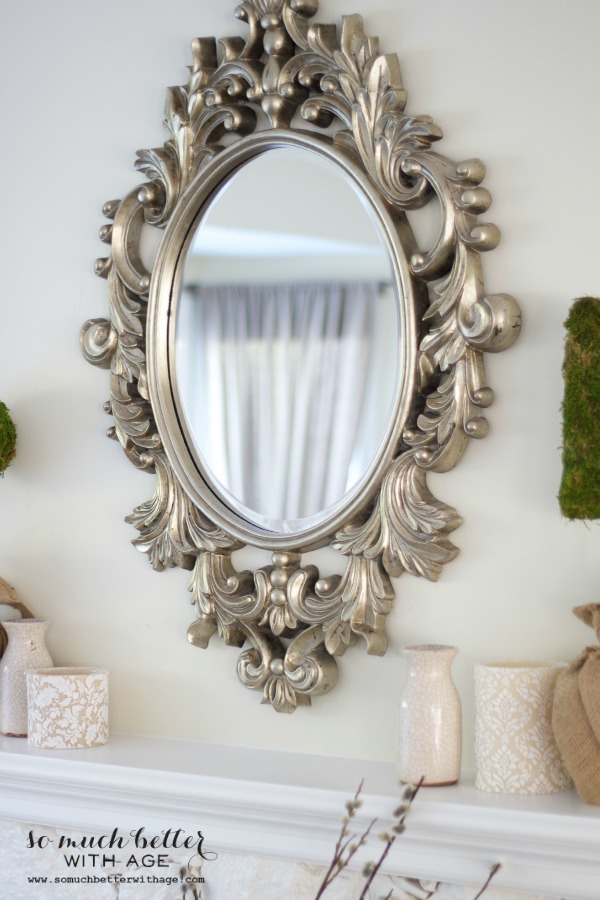 My New French Mirror with gold details hanging above the fireplace.