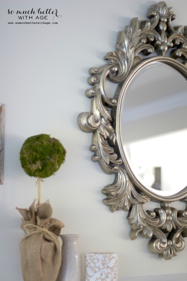 Beautiful French scroll details on the mirror.