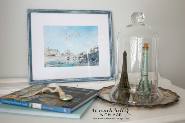 Two Eiffel Towers in a glass cloche.