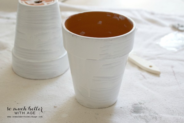 The glaze drying on the pots.