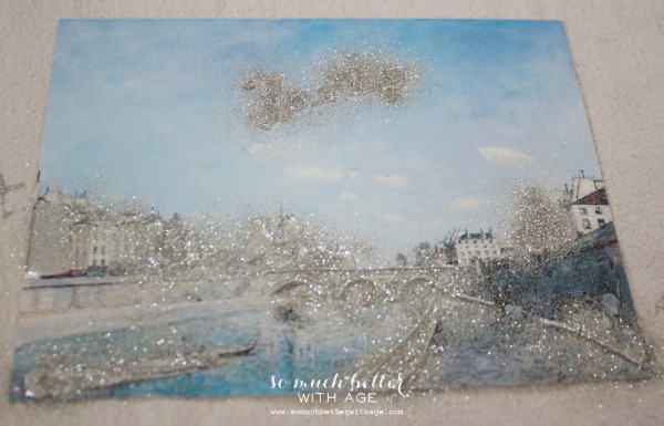 glitter art / DIY artwork makeover via somuchbetterwithage.com Spreading glitter onto the picture.