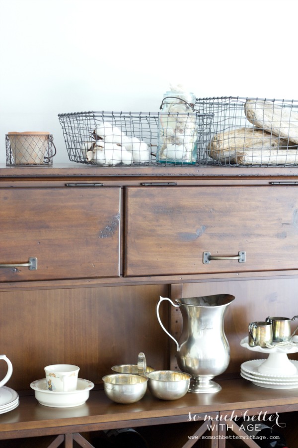 Up close picture of the cabinet with the beach elements on top of it.