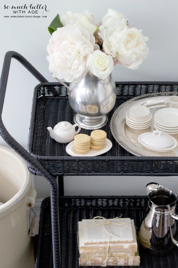 A little tea pot, Cookes and tea cups on the cart.