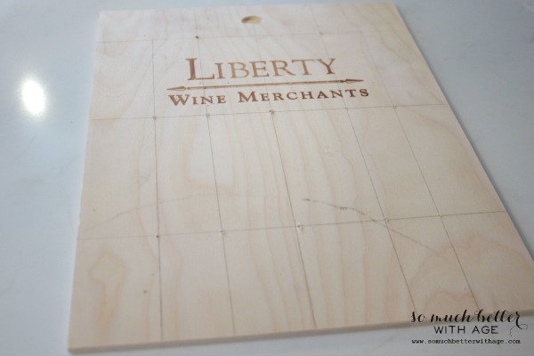 Marking it out on the wine crate with pencil marks.
