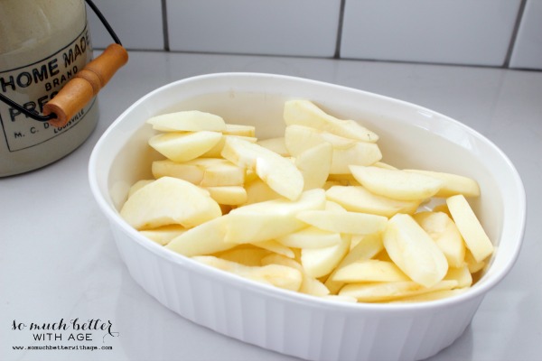 Sliced apples in a casserole dish.