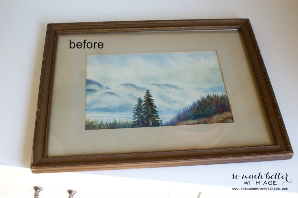 A before picture of an old picture with a worn frame.