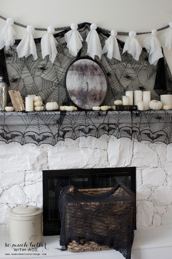White fireplace mantel with spider web.