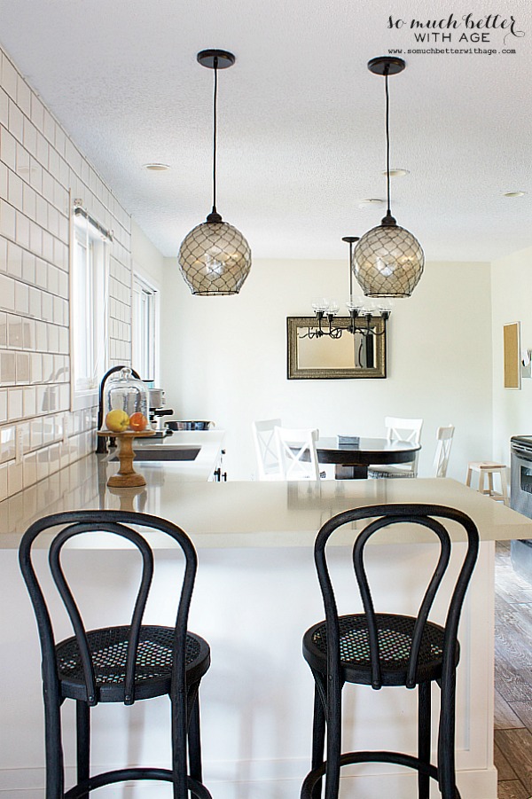 Glass pendant lights above the kitchen island.