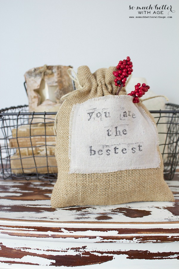 DiY Burlap & Drop Cloth Gift Bag / bag sitting on rustic desk.