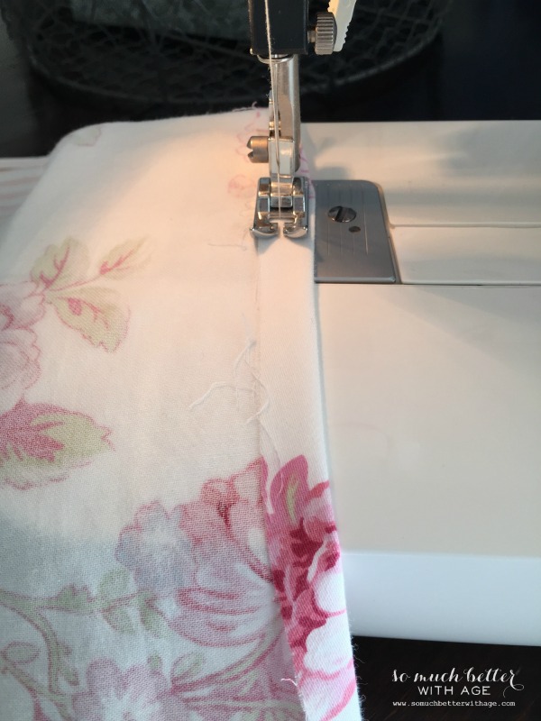 Sewing the curtains with the sewing machine.