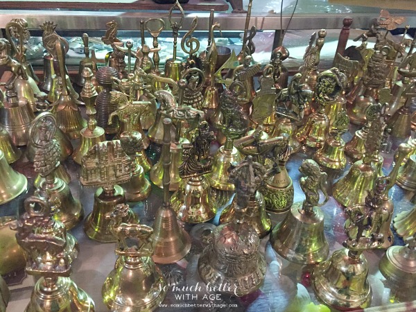 Brass figurines on a table.