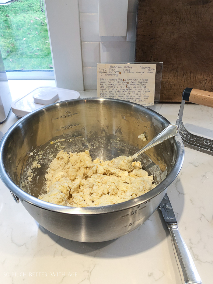 Mixing the dough together with a fork and the recipe beside it.