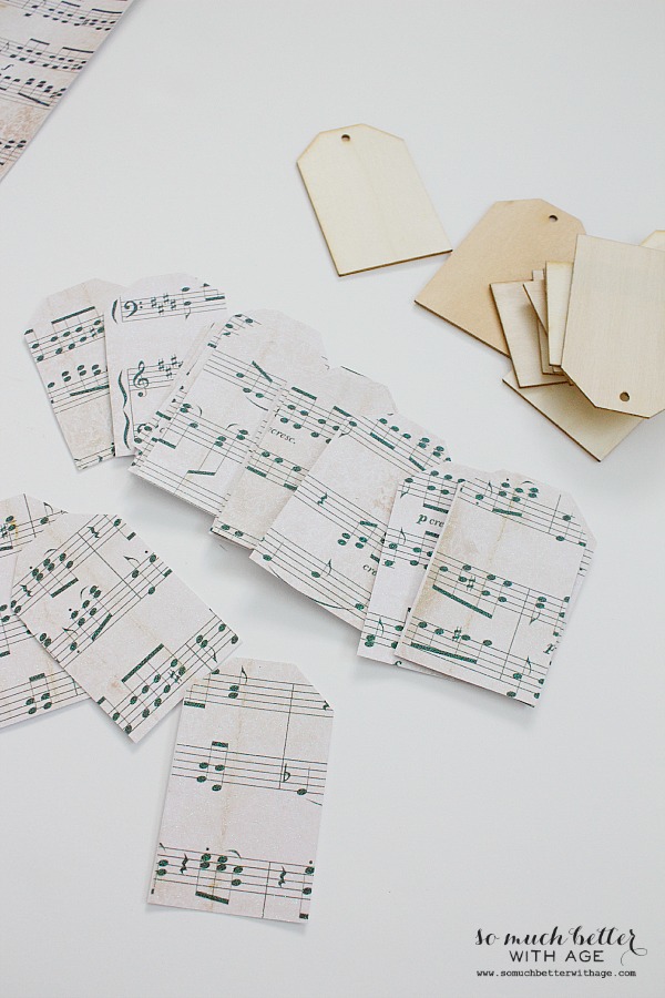 The sheet music cut into strips with wooden tags beside it.