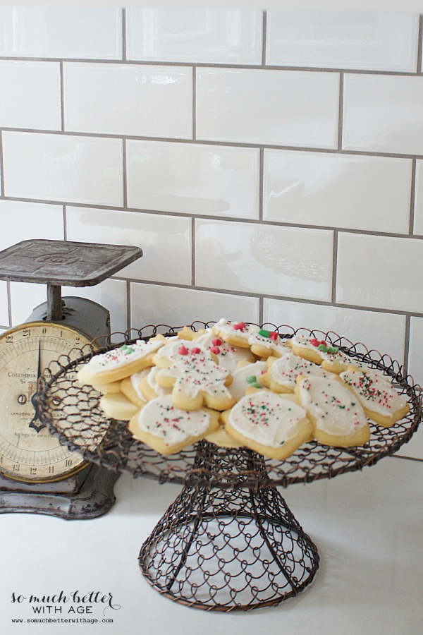 Sugar cookies on a cake stand.