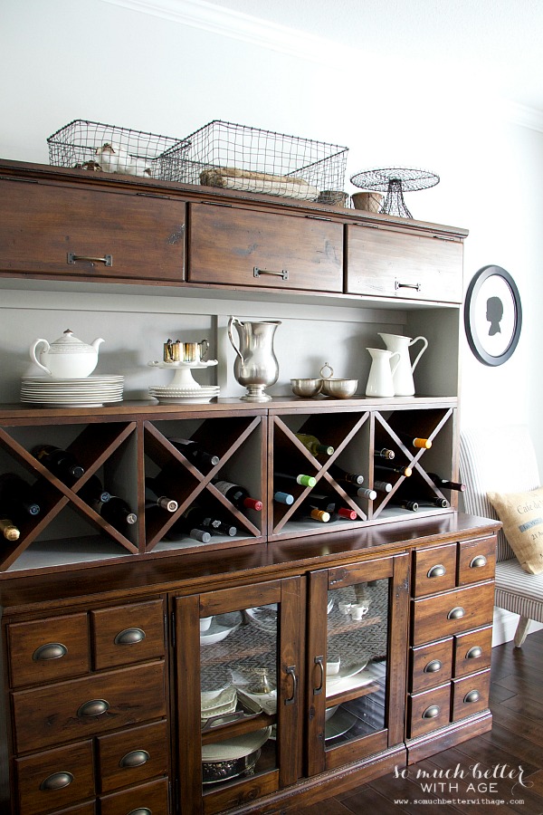 There is a wire basket collection on top of the cabinet.