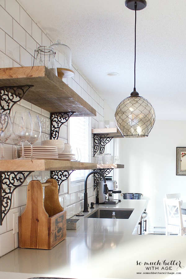 Large pendant lights above the island in the kitchen.