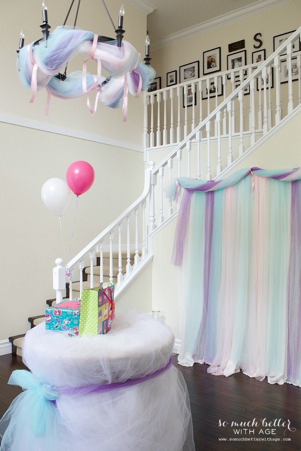 The house decorated with pink, purple and blue tulle.