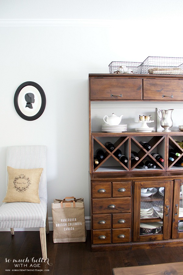 A wine bottle rack in the cabinet.