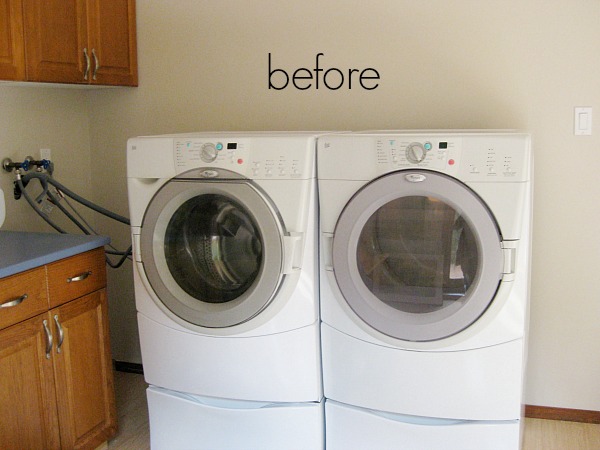 The washer and dryer in the corner of the room.