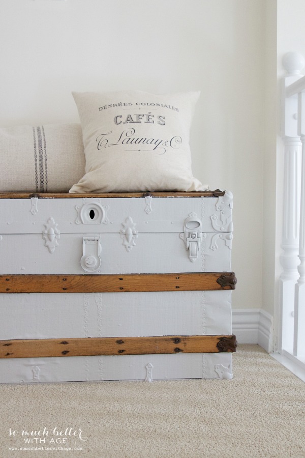 The French pillow on an old trunk.