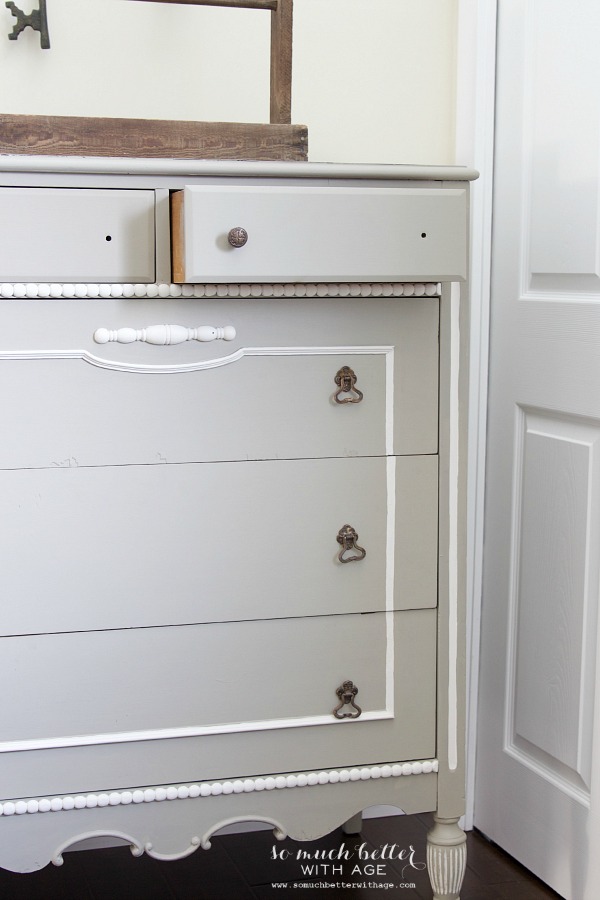 White and gray dresser with French details.