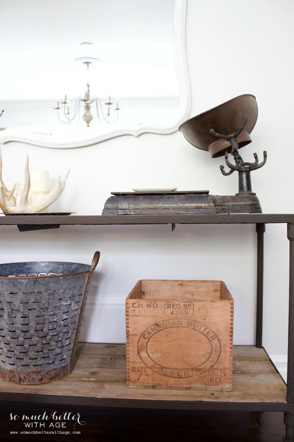 A vintage scale on a small console table.