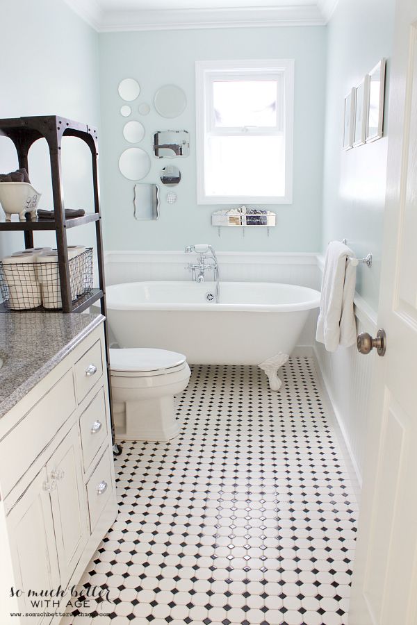 Bathroom with white and black tiled floor.