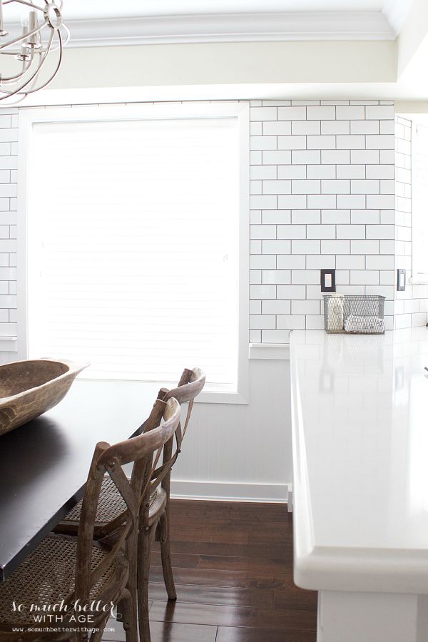 Subway tile in the kitchen that is white.