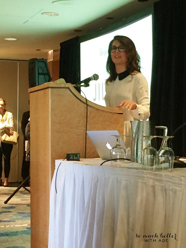 Jillian Harris giving a speech at front of the room.