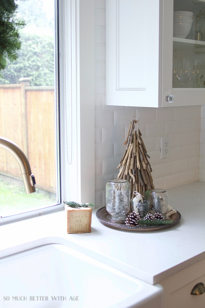  There is a driftwood Christmas tree in the kitchen.