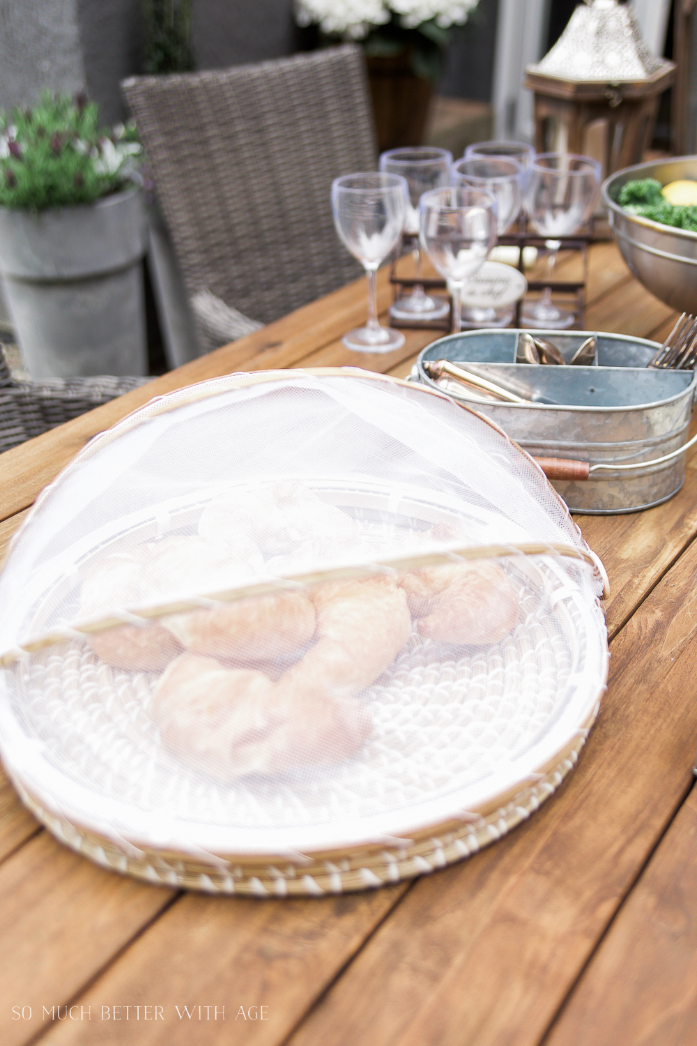 A tray with food and a covering over the food to protect from bugs.