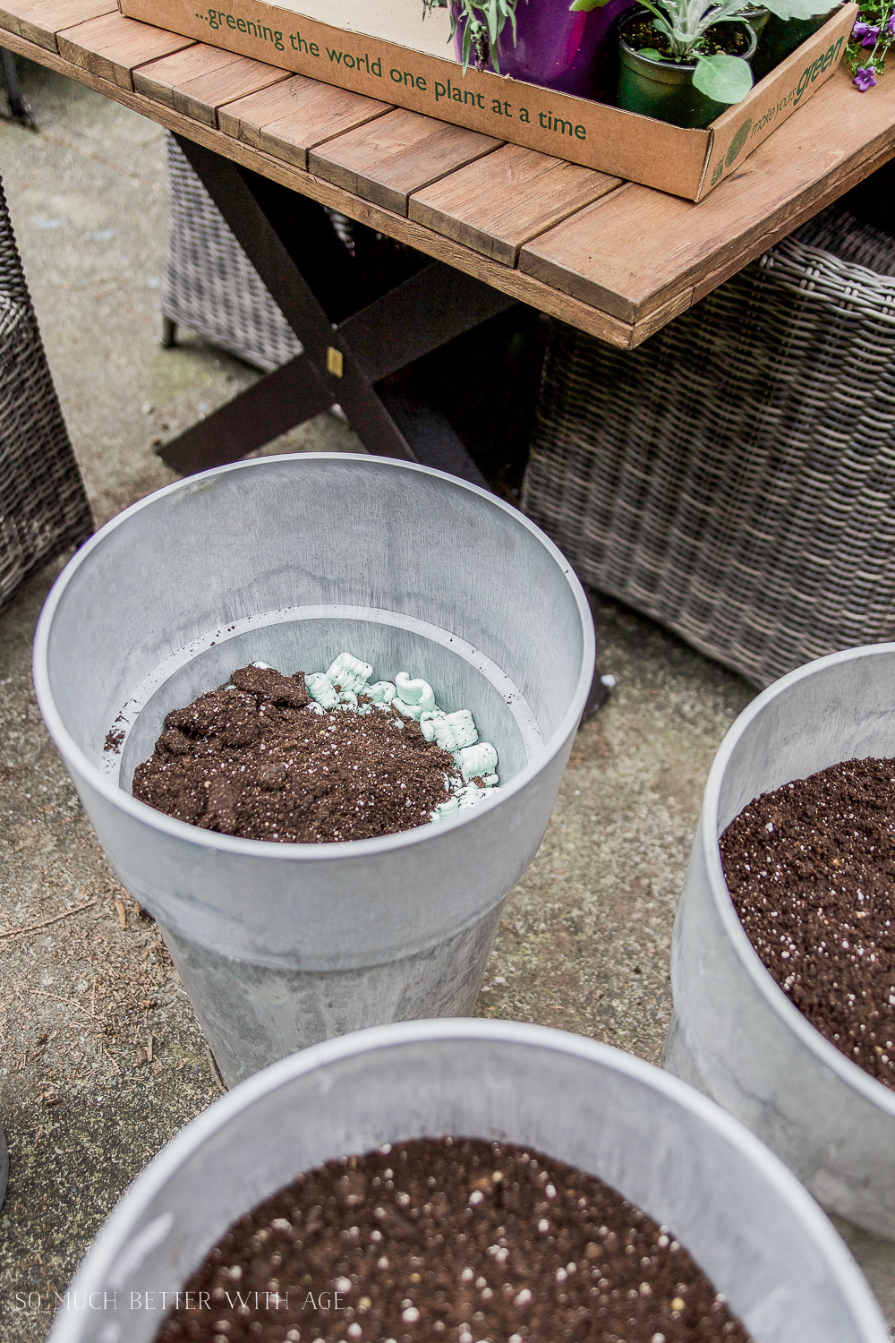 Soil on top of the styrofoam in the steel planters.