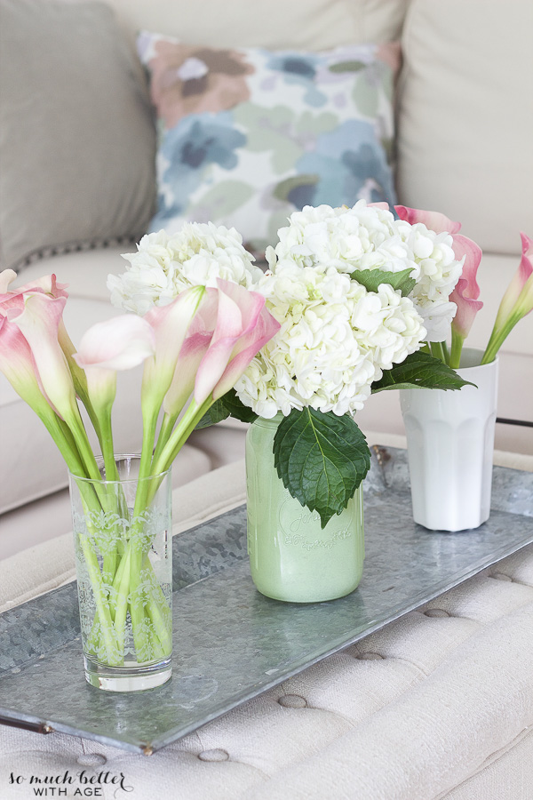 A silver tray with flowers on them.