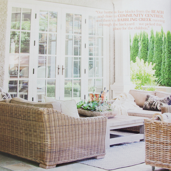 French doors by patio with wicker furniture.