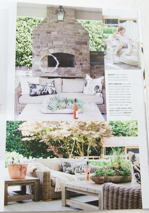 The outdoor area with a outdoor oven and sectional seating on patio.