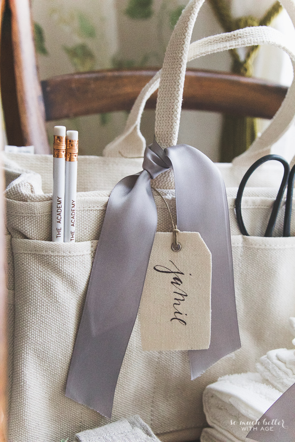 Styling a bag with a lilac bow.